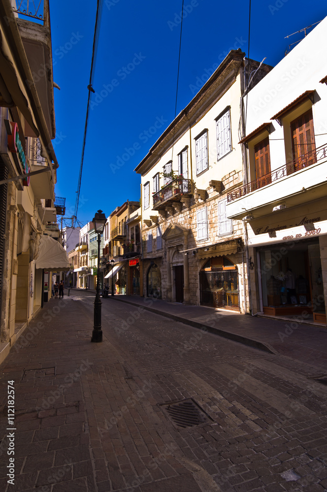 Street with shops at the old medieval part of the city Rethymno, Crete, Greece