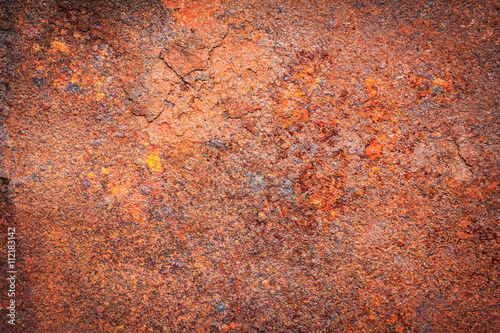 Abstract background texture of rusty dirty iron metal plate. Old rusty metal. Red rusted metal with copy space for text or image. Dark edged