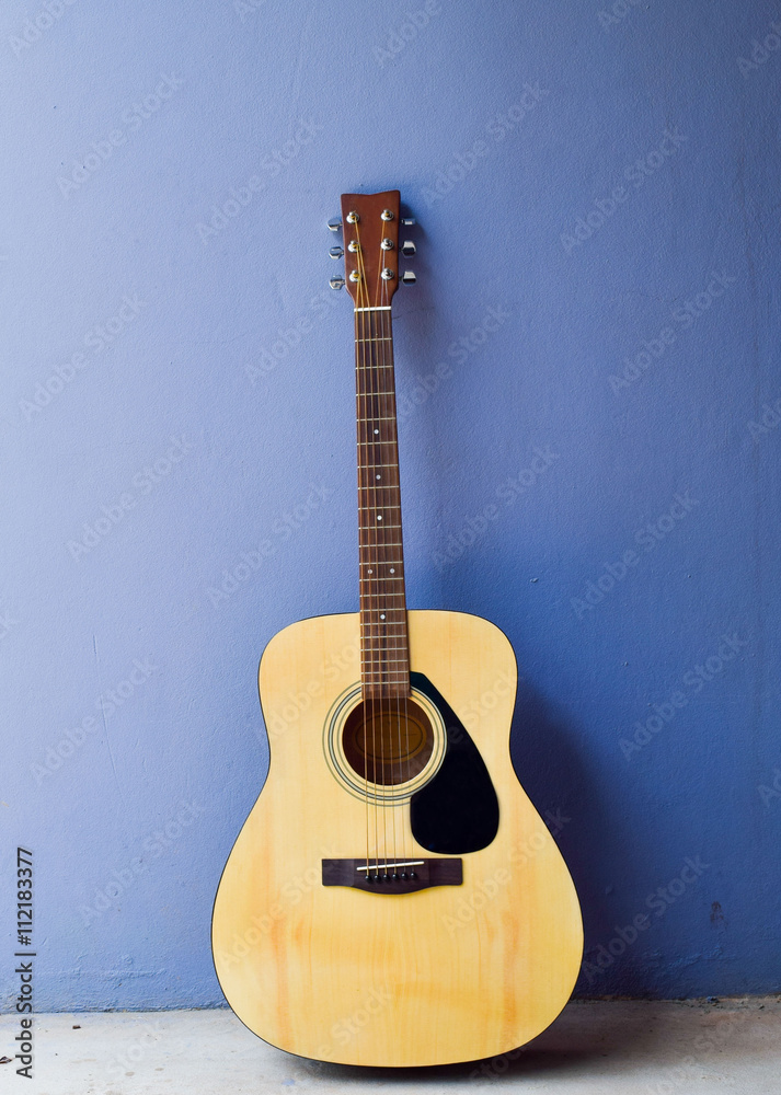 The guitar on gray background