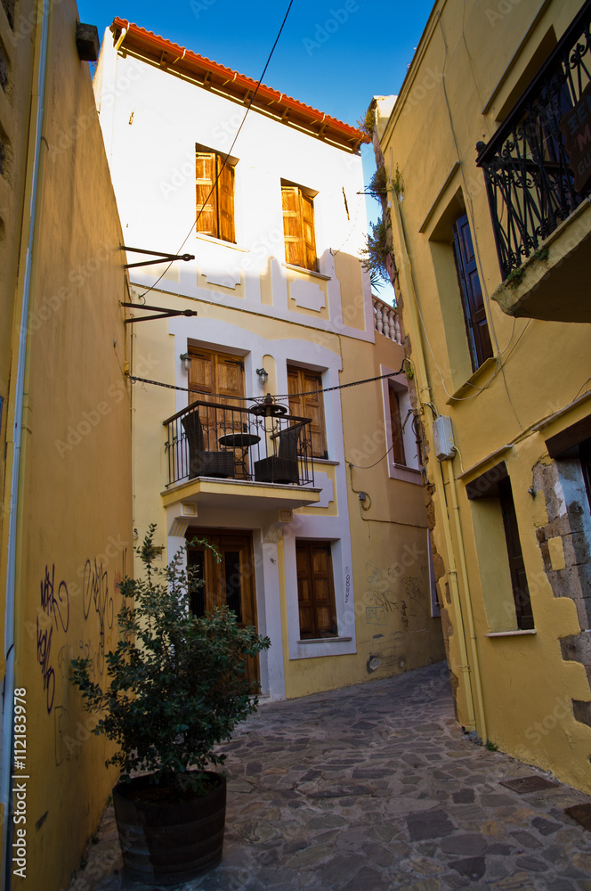 One of the narrow streets at old medieval city and harbor Rethymno, Crete, Greece