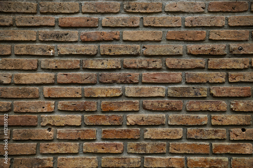 brick background. brick background and empty area for text. wall brick in retro style. old brick or crack brick background. damage wall and stand by for repair.