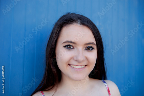 Teenage girl with a blue background