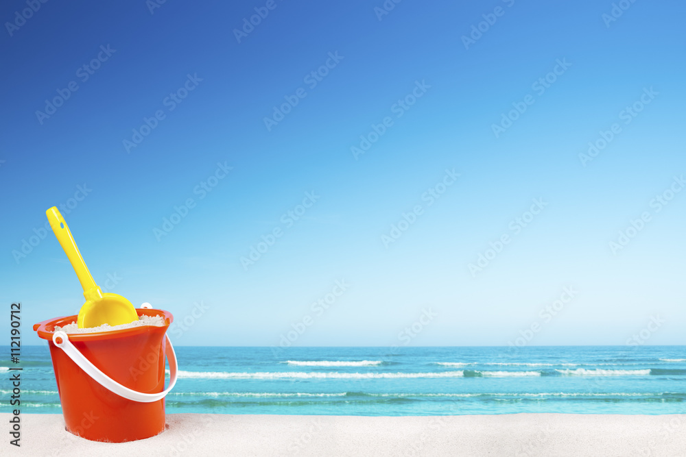 Beach toys on the beach on a clear sunny day Beach toys on the beach on a clear sunny day