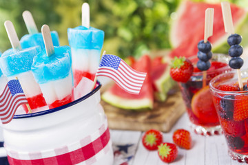 Red-white-and-blue popsicles on an outdoor table