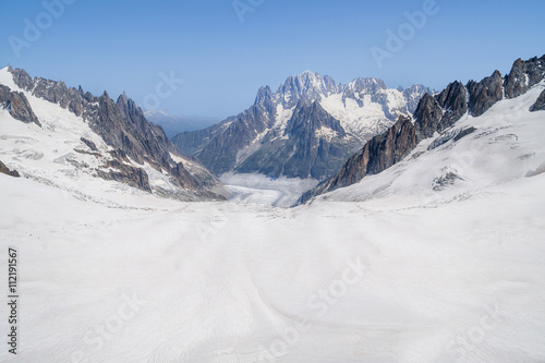 Rocks and peaks of the mountains in summer season, close to the sky. French Alps, Mont Blanc massif, Chamonix.