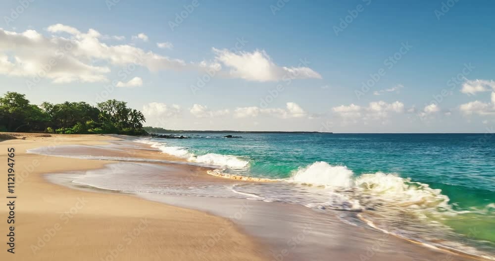 Aerial view flying over tropical white sand beach at sunrise Aerial view flying over tropical white sand beach at sunrise