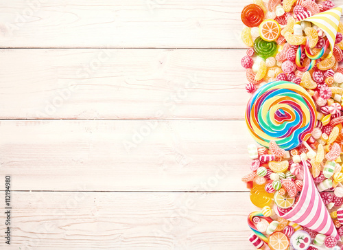 Background of wood slat table piled with sweets