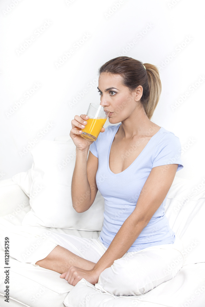 Young beautiful smiling woman with glass of orange juice Young beautiful smiling woman with glass of orange juice