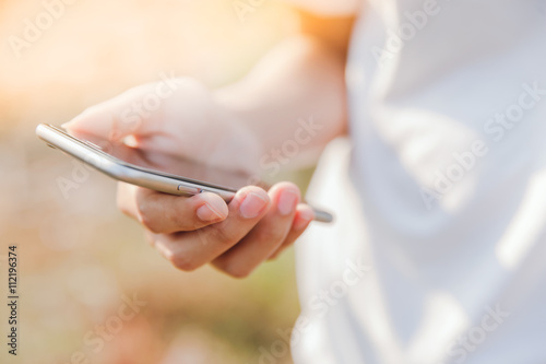 Woman using her Mobile Phone