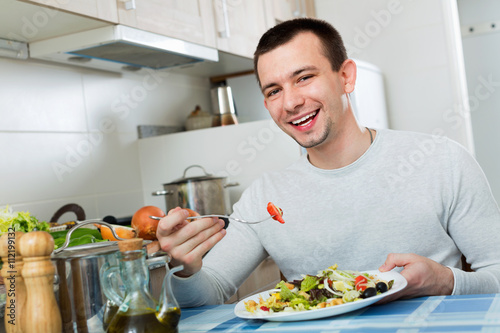 Ordinary  handsome man holding plate