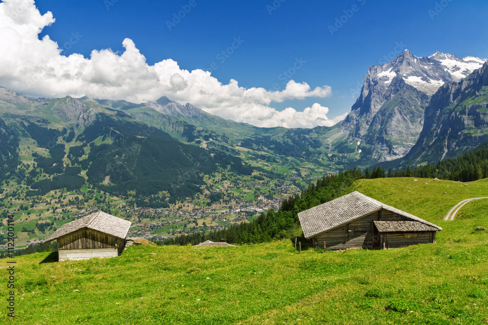 Beautiful idyllic mountains landscape with country house (chalet) in summer, Alps, Switzerland
