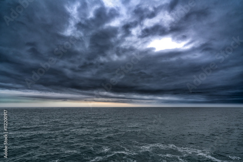 Dark stormy cloud above the sea, dark tone nature abstract © Urbanscape