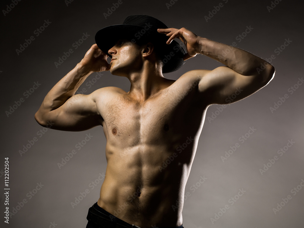 Sexy muscular man in hat