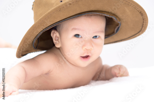 Asian baby lying on stomach
