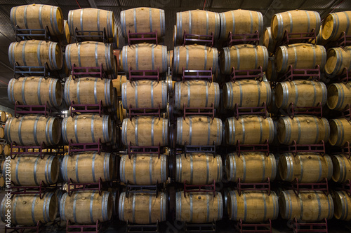 Wine barrels stacked in cellar, Bordeaux Vineyard