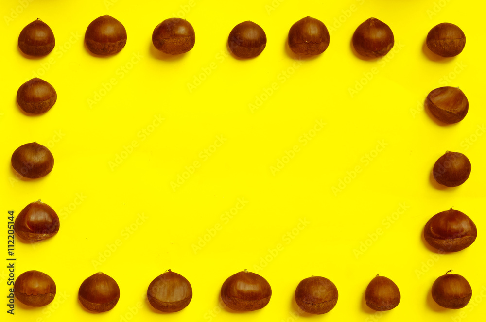 Chestnuts pattern on yellow background top view chestnut Chestnuts pattern on yellow background top view chestnut