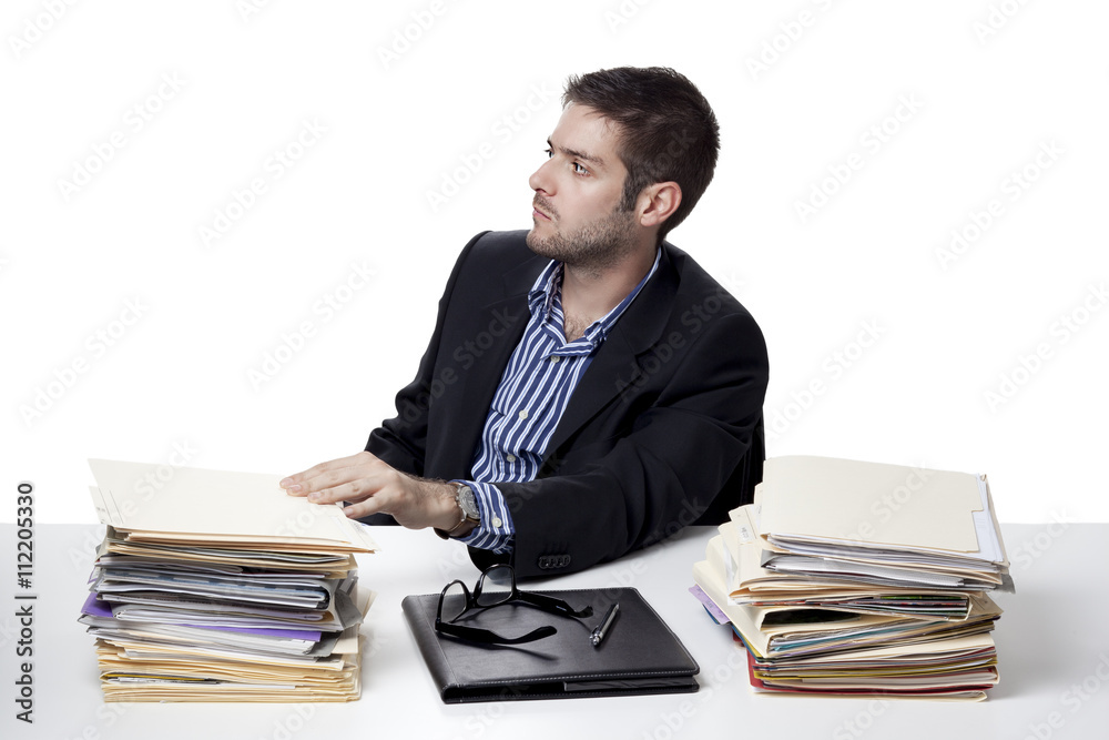 businessman looking away while at work. businessman looking away while at work.
