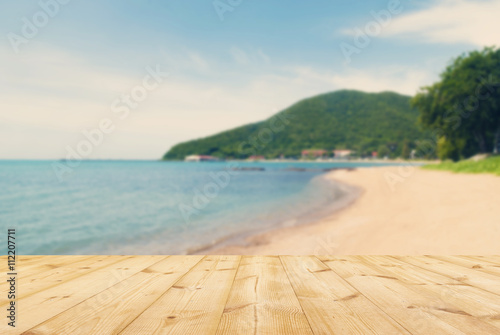 Wooden floor with sea beach background,retro or vintage style.