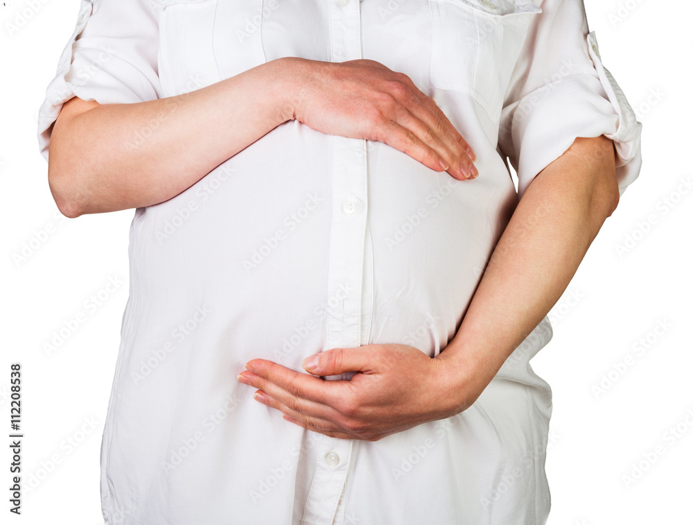 Pregnant woman tenderly embracing the stomach isolated on white. Pregnant woman tenderly embracing the stomach isolated on white.
