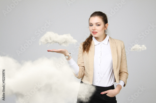 Young woman and cloud, cloud computing concept photo