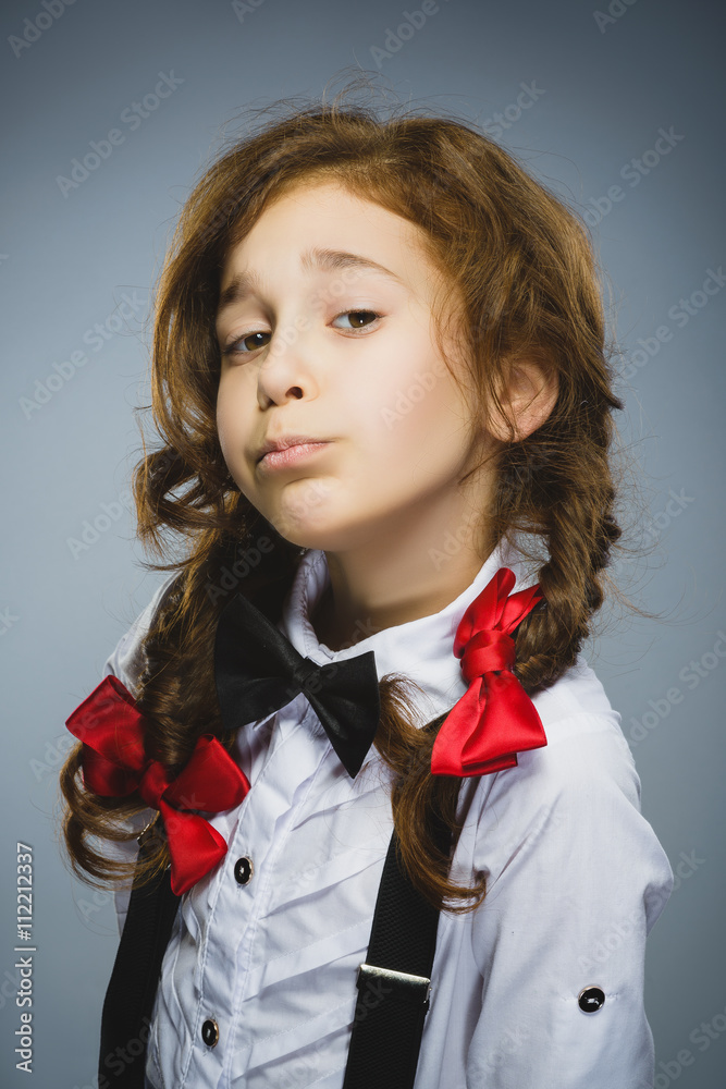 Portrait of offense girl isolated on gray background. Negative human emotion, facial expression. Closeup Portrait of offense girl isolated on gray background. Negative human emotion, facial expression. Closeup
