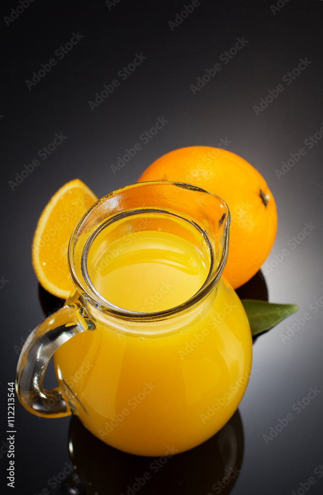 orange juice and fruit on black orange juice and fruit on black