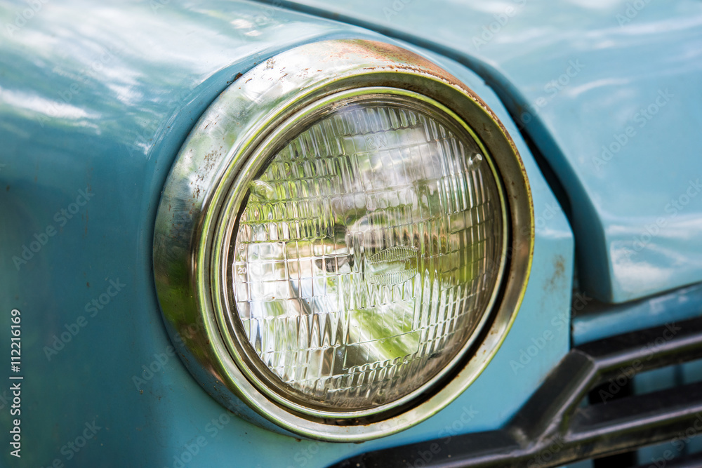 Old car with close-up on headlights