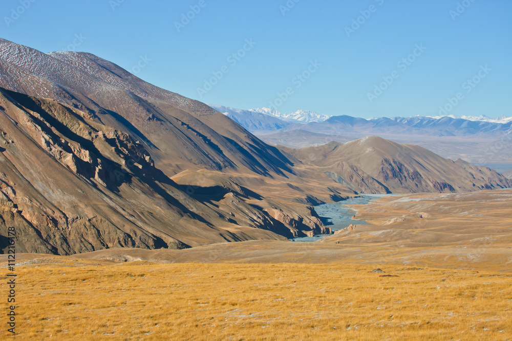 Views of river valley and mountain range in autumn in the Tien S