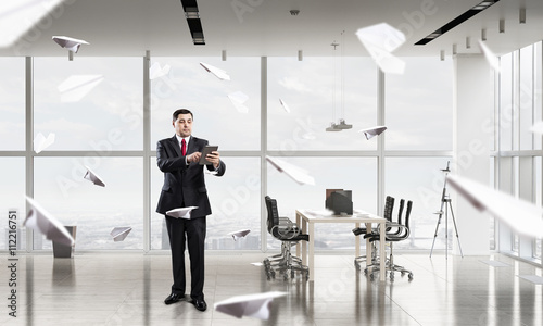 Businessman with tablet in hand