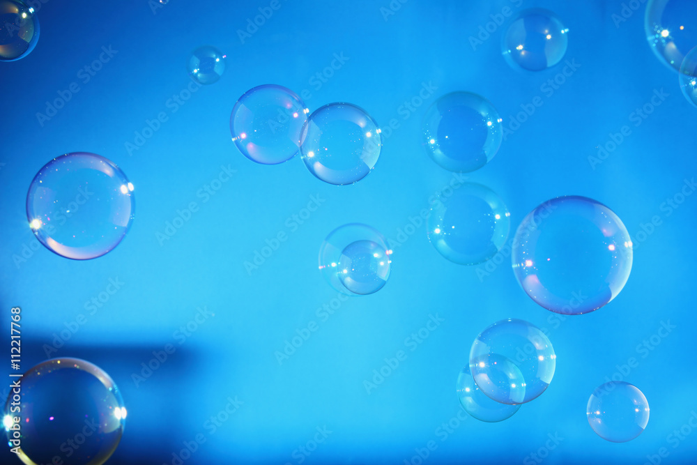 Rainbow air bubbles on a blue backgrounds