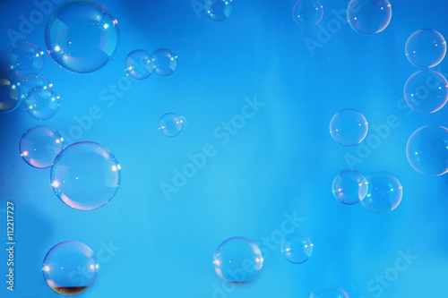 Rainbow air bubbles on a blue backgrounds