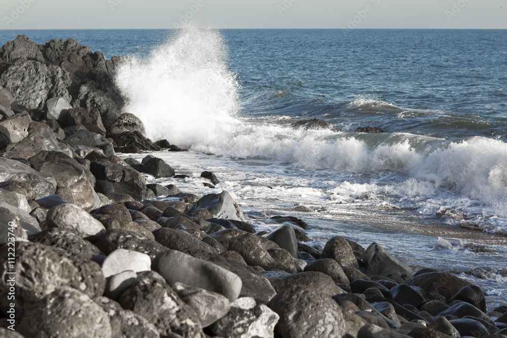 The waves of the Pacific ocean, the beach landscape. The ocean and waves during strong winds in United States, California. Waves breaking on the rocks. The waves of the Pacific ocean, the beach landscape. The ocean and waves during strong winds in United States, California. Waves breaking on the rocks.