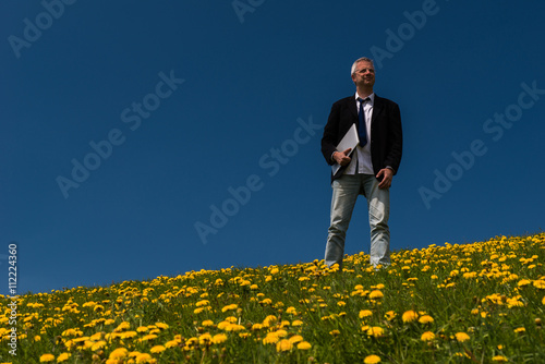 Man at work in a dandelion field