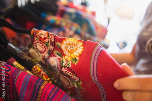 clothing rack of Guatemalan dresses