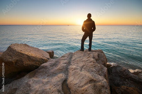 Man on the shore. Relax composition.