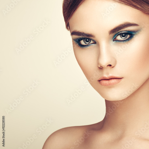Beautiful woman face. Perfect makeup. Beauty fashion. Eyelashes. Lips. Cosmetic Eyeshadow. Perfect skin