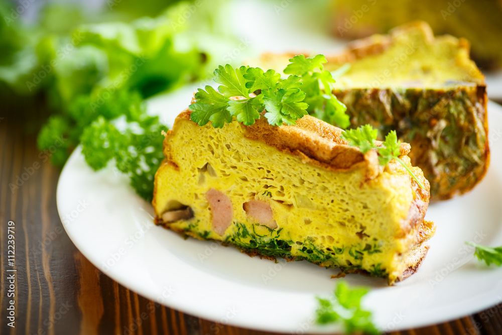 baked omelette with sausages and greens