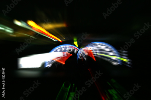 Car driving fast motion blur with slow speed shutter.
