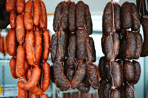 Mediterranean sausages in spain hanging in rows © lunamarina