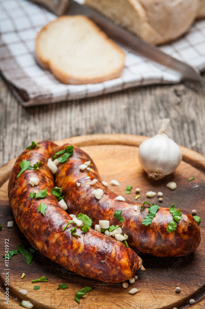 Closup of homemade sausages on woodn cutting board Closup of homemade sausages on woodn cutting board