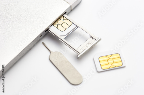 two sim card and sim card tray and sim card eject tool put nearl