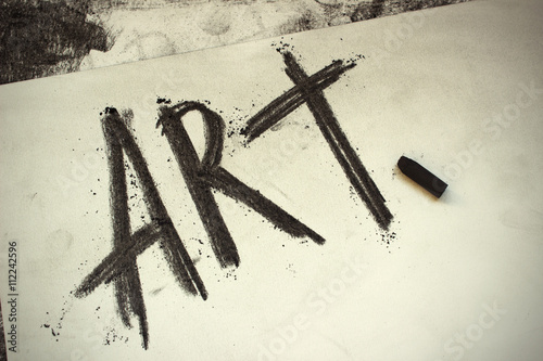 Word Art hand drawing with Black Charcoal. Artist's work canvas with grungy drawing word "Art".