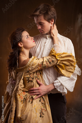Beautiful couple woman and man in medieval clothes