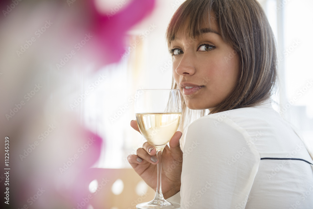 Portrait of a woman drinking white wine Portrait of a woman drinking white wine