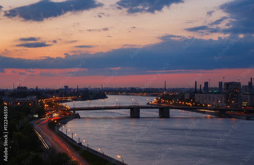 Evening river view. Cityscape in sunset. Neva river, Saint Petersburg.