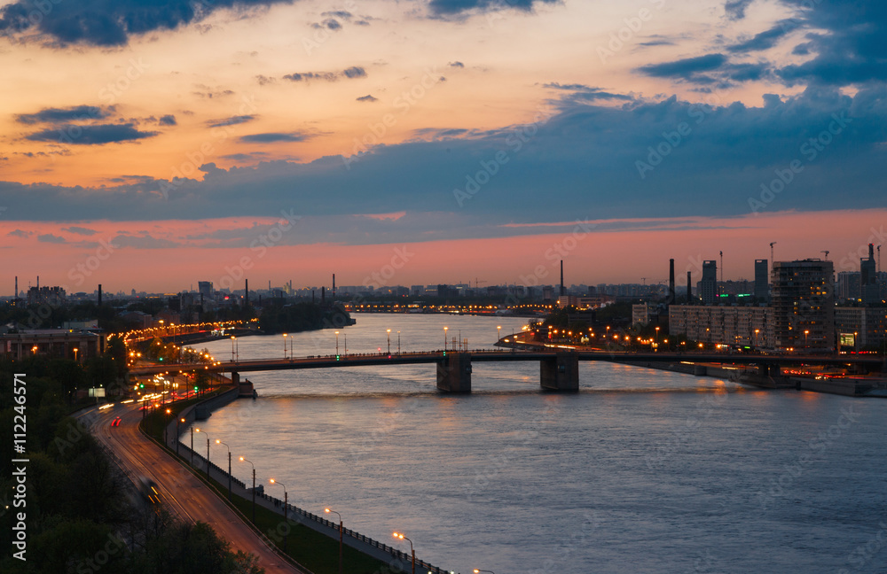 Evening river view. Cityscape in sunset. Neva river, Saint Petersburg.