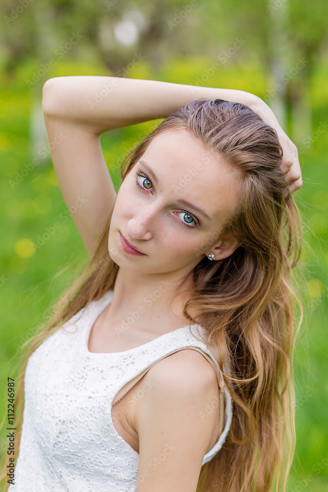 portrait of happy girl on nature in summer portrait of happy girl on nature in summer