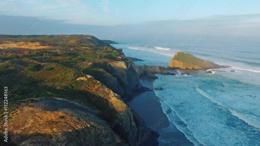 Early morning on the ocean cliffs Algarve Portugal aerial view Early morning on the ocean cliffs Algarve Portugal aerial view