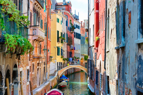 Small canal between houses in Venice