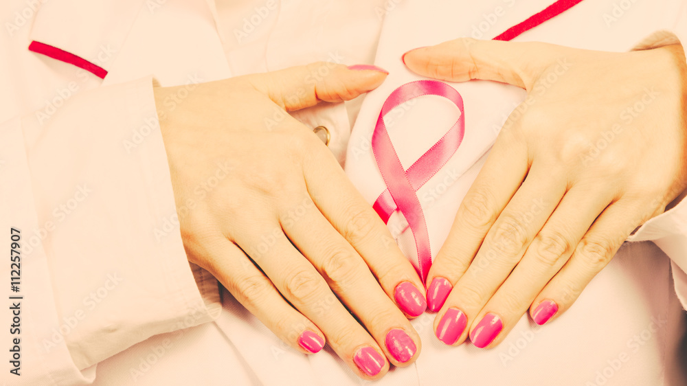 Hands heart on pink ribbon symbol Hands heart on pink ribbon symbol